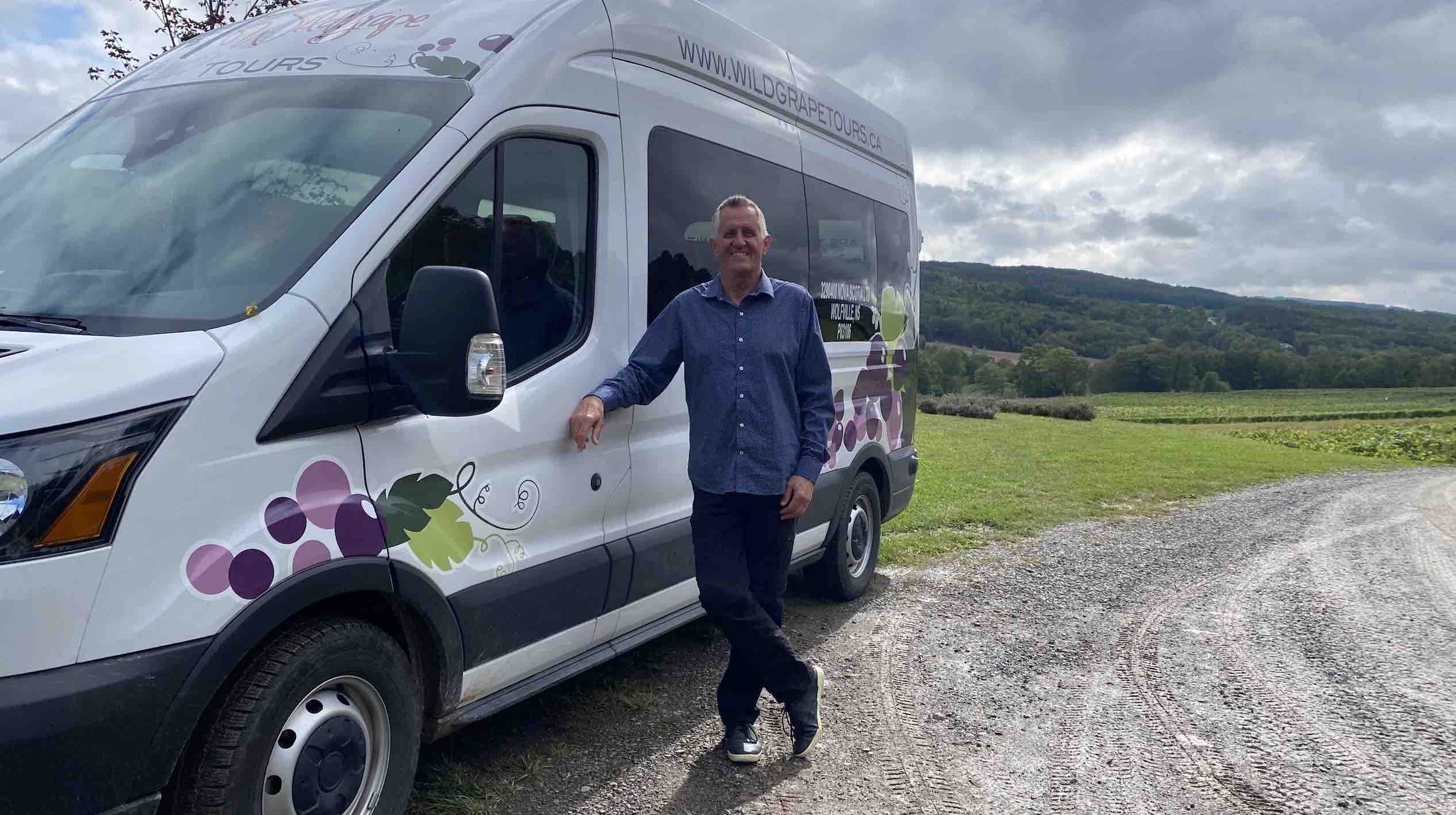 Wild Grape Tours van and driver on nova scotia winery tour